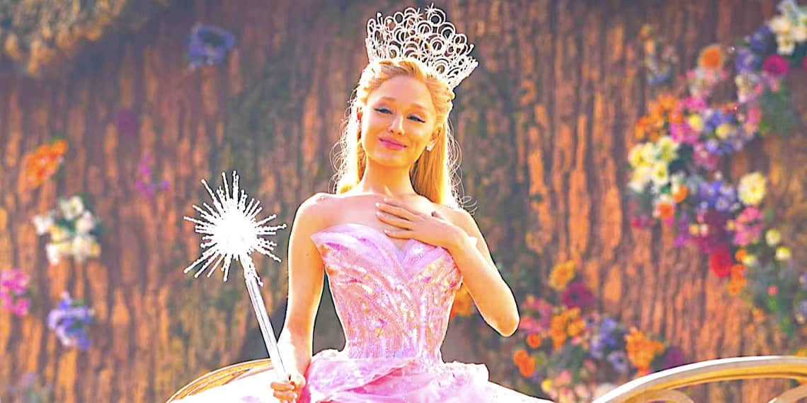 ariana-grande-s-glinda-puts-a-hand-to-her-chest-in-wicked