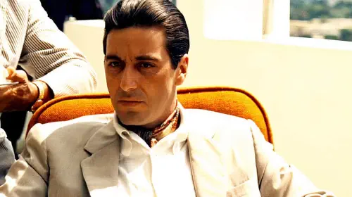 assets/al-pacino-as-michael-corleone-sitting-down-outside-in-the-godfather-2.jpeg