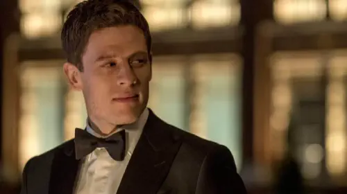 assets/james-norton-as-alex-godman-wearing-a-tuxedo-and-bow-tie-looking-at-someone-off-screen-with-a-smirk-in-mcmafia-1.jpeg