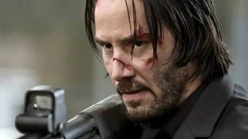 assets/keanu-reeves-holding-shotgun-in-john-wick.jpeg