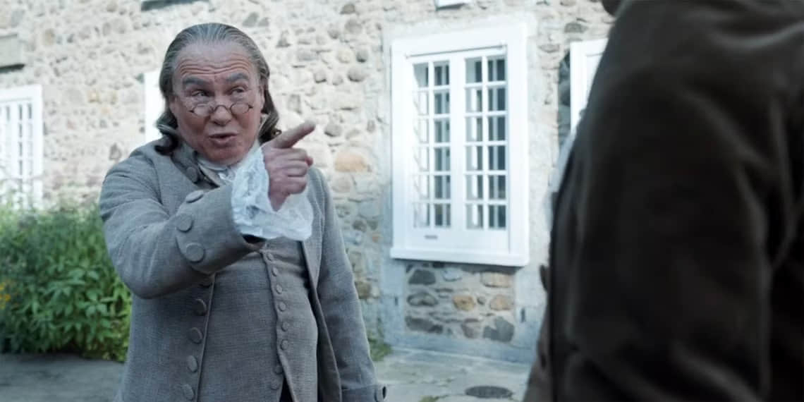 neil-crone-as-ben-franklin-pointing-a-finger-at-higgintoot-in-ghosts-season-2