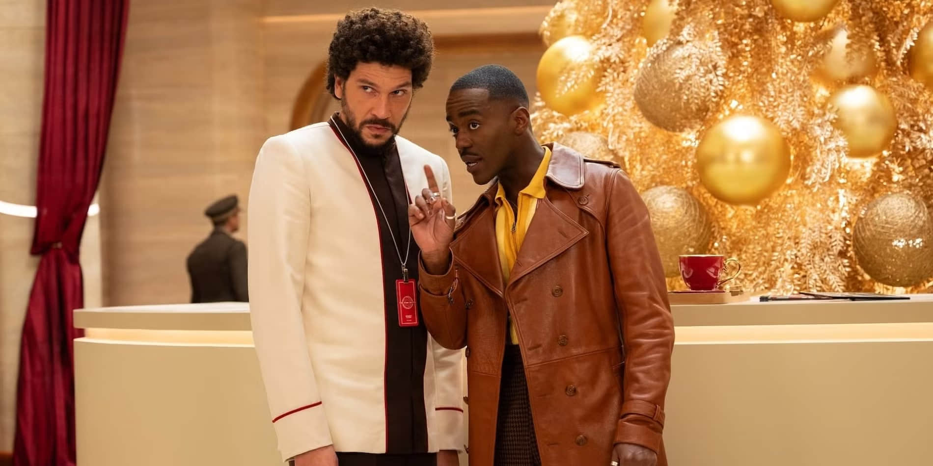 joel-fry-and-ncuti-gatwa-standing-in-the-time-hotel-lobby-in-doctor-who-christmas-special