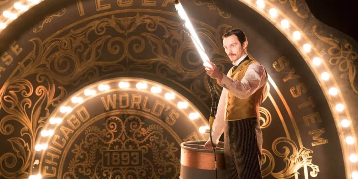 nicholas-hoult-holding-an-electric-light-as-nikola-tesla-in-the-movie-the-current-war