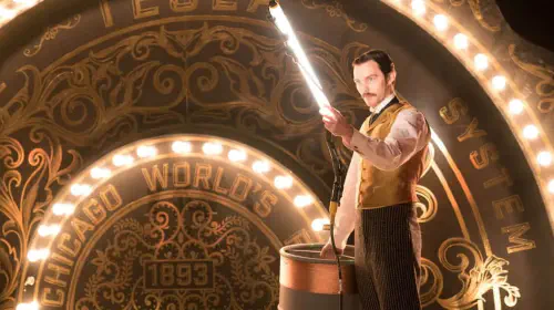 assets/nicholas-hoult-holding-an-electric-light-as-nikola-tesla-in-the-movie-the-current-war.jpeg