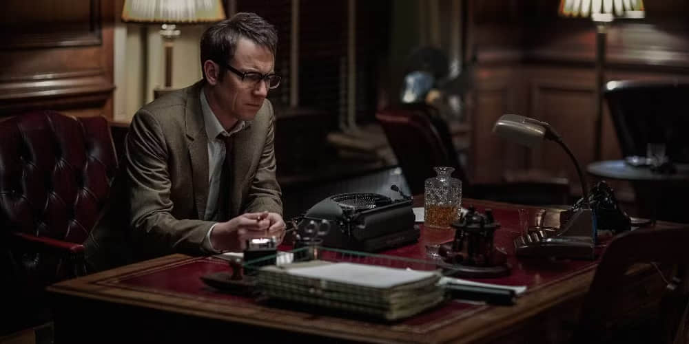 An-image-of-Frank-looking-sad-at-his-desk-in-Outlander
