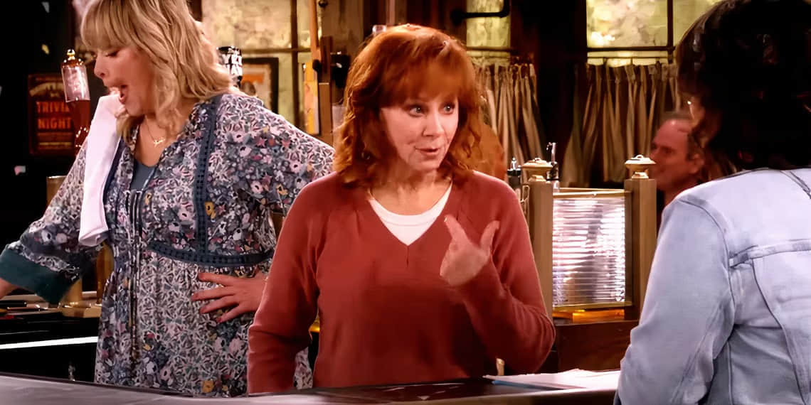 reba-points-the-finger-at-herself-while-at-the-bar-in-happy-s-place