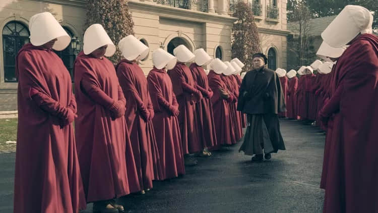 aunt-lydia-walking-among-the-handmaids