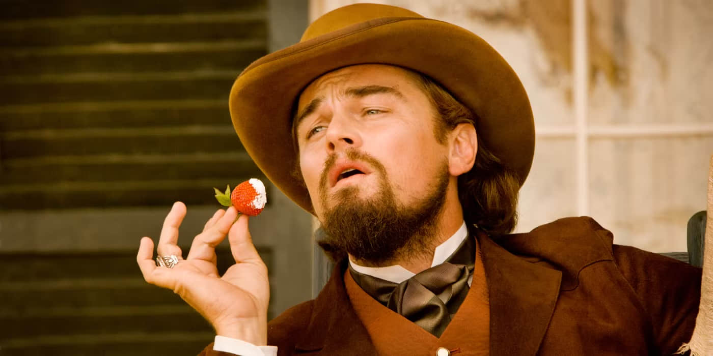leonardo-dicaprio-as-calvin-candie-with-a-strawberry-in-django-unchained