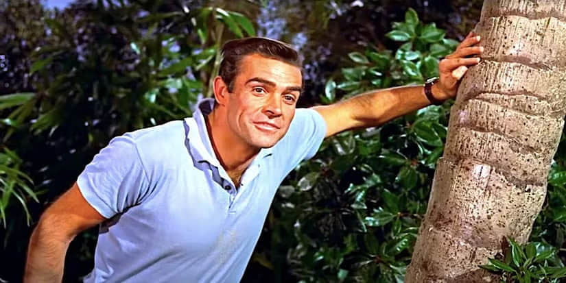 sean-connery-s-james-bond-leans-against-a-palm-tree-in-dr-no