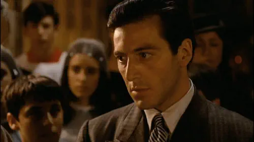 assets/michael-corleone-during-a-baptism-in-the-film-the-godfather.jpeg