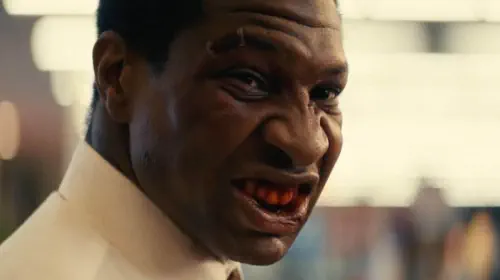 assets/jonathan-majors-as-killian-maddux-with-a-bloody-mouth-in-the-movie-magazine-dreams.jpeg