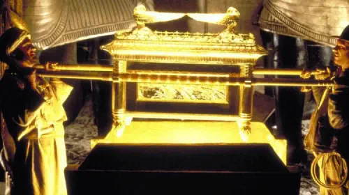 assets/indiana-jones-helps-lift-the-ark-of-the-covenant-in-raiders-of-the-lost-ask.jpeg