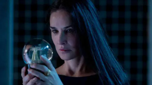 assets/demi-moore-looks-at-a-snowball-in-the-substance.jpeg