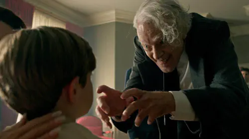 assets/brad-dourif-drooling-and-scaring-a-child-in-the-tv-show-chucky.jpeg