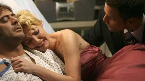 assets/katherine-heigl-as-izzie-stevens-in-grey-s-anatomy-holding-onto-denny-alex-taking-her-away.jpeg