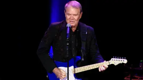 assets/glen-campbell-plays-a-blue-guitar-in-the-documentary-movie-glen-campbell-i-ll-be-me.jpeg