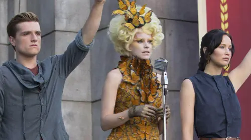 assets/the-hunger-games-catching-fire-peeta-effie-and-katniss.jpeg