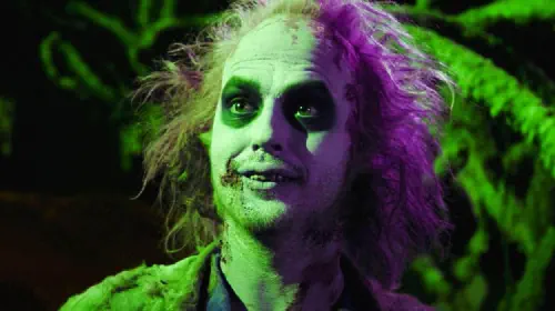 assets/michael-keaton-as-beetlejuice-with-a-green-hue.jpeg