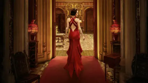 assets/a-woman-in-a-red-dress-walks-through-downton-abbey-the-grand-finale.jpeg
