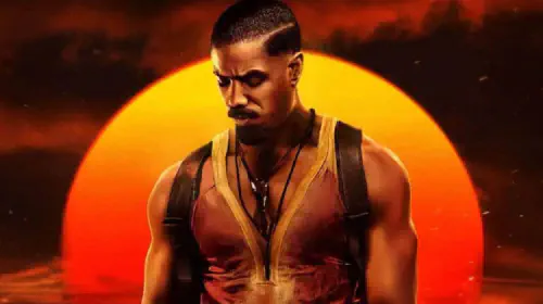 assets/michael-b-jordan-in-front-of-the-setting-sun-in-the-poster-for-the-2025-movie-sinners.jpeg