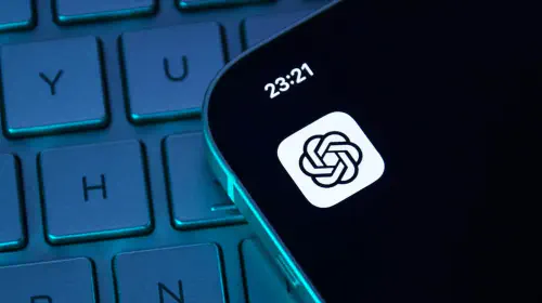 assets/ChatGPT-app-icon-on-iPhone-sitting-on-top-of-darkened-keyboard.jpeg