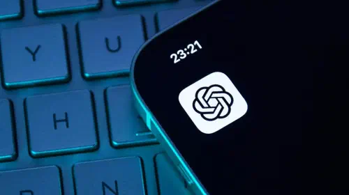 assets/ChatGPT-app-icon-on-iPhone-sitting-on-top-of-darkened-keyboard.jpeg