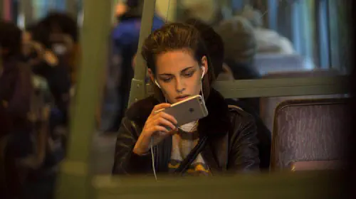 assets/kristen-stewart-looks-at-her-phone-in-personal-shopper.jpeg