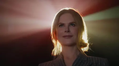 assets/nicole-kidman-smiles-in-front-of-a-movie-projector-in-amc-theaters-ad.jpeg
