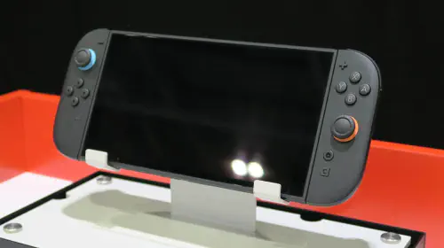 assets/Nintendo-Switch-2-hands-on-screen-off-handheld-angled-stand.jpeg