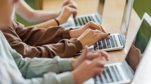 assets/students-typing-on-laptops-GettyImages_1513744777.jpeg