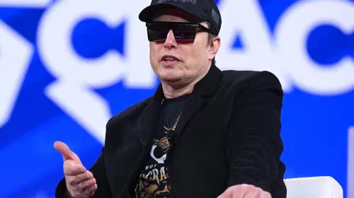 assets/musk-cpac-sunglasses-doge.jpeg