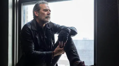assets/negan-sitting-by-a-window-in-the-walking-dead-dead-city.jpeg