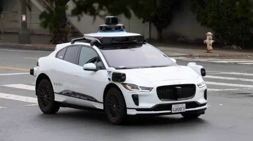 assets/Waymo-Tesla.jpeg