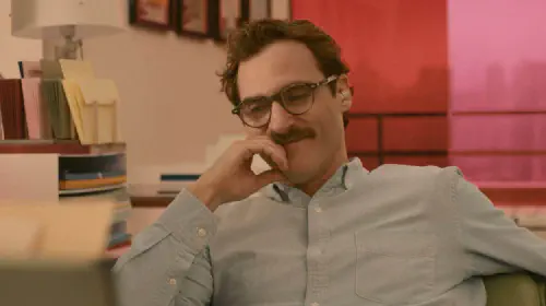 assets/joaquin-phoenix-smiling-in-her.jpeg