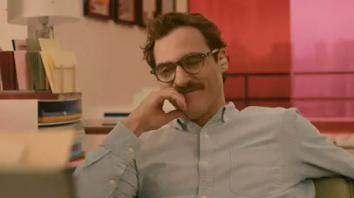 assets/joaquin-phoenix-smiling-in-her.jpeg