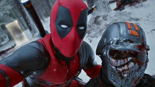 assets/ryan-reynolds-as-deadpool-holding-tva-agent-in-deadpool-wolverine-1.jpeg