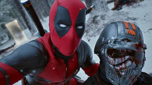 assets/ryan-reynolds-as-deadpool-holding-tva-agent-in-deadpool-wolverine-1.jpeg