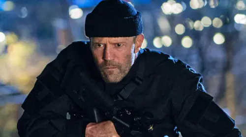 assets/jason-statham-with-rifle-in-operation-fortune.jpeg