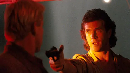assets/mel-gibson-as-martin-riggs-and-gary-busey-as-joshua-in-lethal-weapon.jpeg