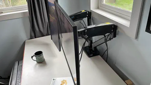 assets/huanuo-hnds-12-dual-monitor-arm.jpeg