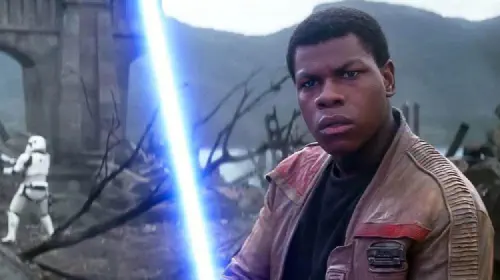 assets/john-bodega-holds-a-lightsaber-in-the-star-wars-franchise.jpeg