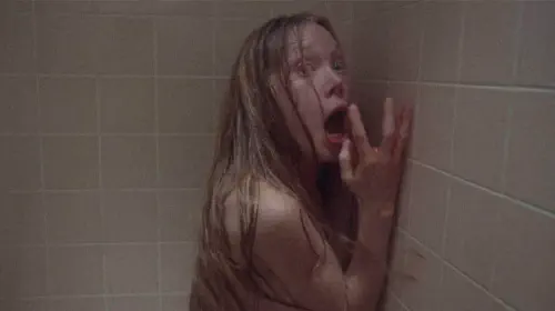 assets/carrie-white-is-terrified-in-the-school-shower.jpeg