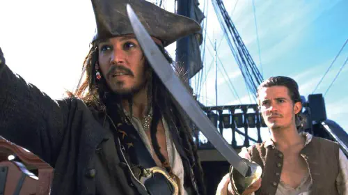 assets/johnny-depp-and-orlando-bloom-in-pirates-of-the-caribbean-the-curse-of-the-black-pearl-1.jpeg