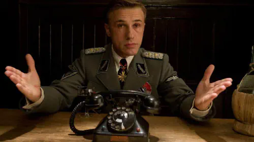 assets/christoph-waltz-as-hans-landa-with-a-phone-in-inglourious-basterds.jpeg
