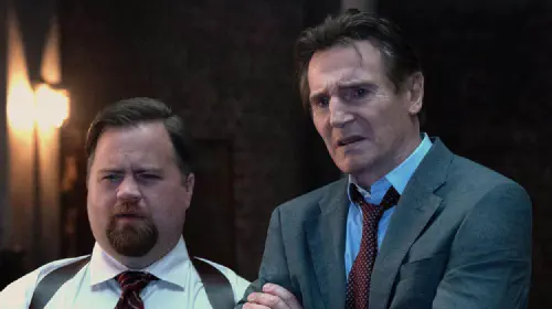 assets/liam-neeson-and-paul-walter-hauser-in-the-naked-gun-2025.jpeg