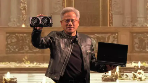 assets/Nvidia-CEO-Jensen-Huang-at-Computex-2025-holding-RTX-5060-and-laptop.jpeg