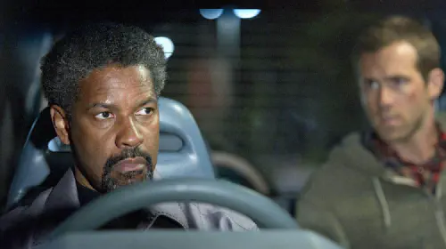 assets/denzel-washington-and-ryan-reynolds-in-safe-house.jpeg