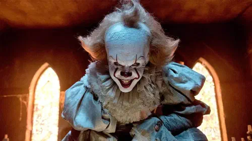 assets/pennywise-crouching-in-stephen-king-s-it.jpeg