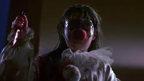 assets/danielle-harris-holds-a-knife-in-halloween-4.jpeg