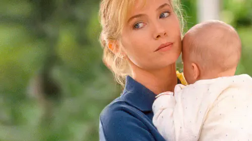 assets/rebecca-de-mornay-holds-a-baby-in-the-hand-that-rocks-the-cradle.jpeg